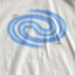 White t-shirt with blue spiral design and text