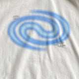 White t-shirt with blue spiral design and text