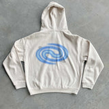 White hoodie with a blue spiral design on the back